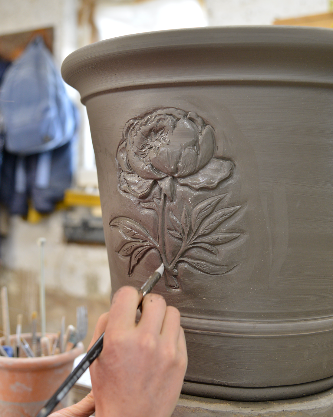 Emma decorating a peony planter