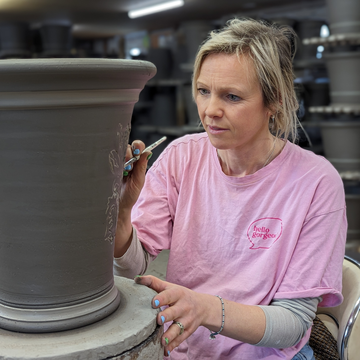 Emma decorating a flowerpot